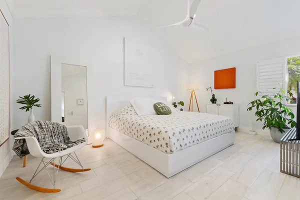 a room with a bed and a chair