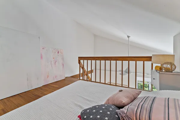 a bed room with a bed and a window