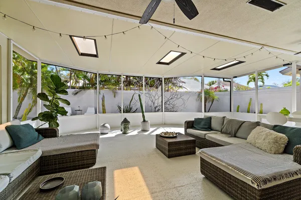 a living room with a large window and table
