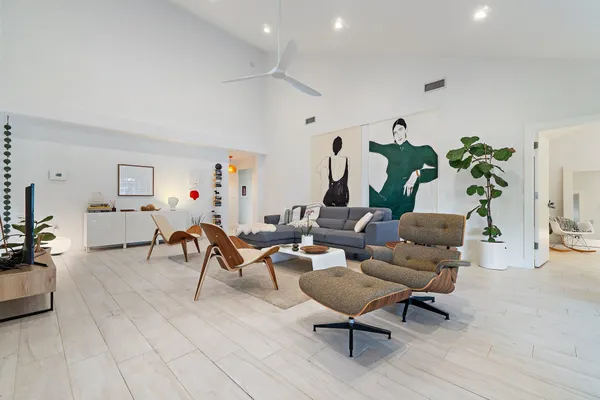 a living room with furniture and a rug