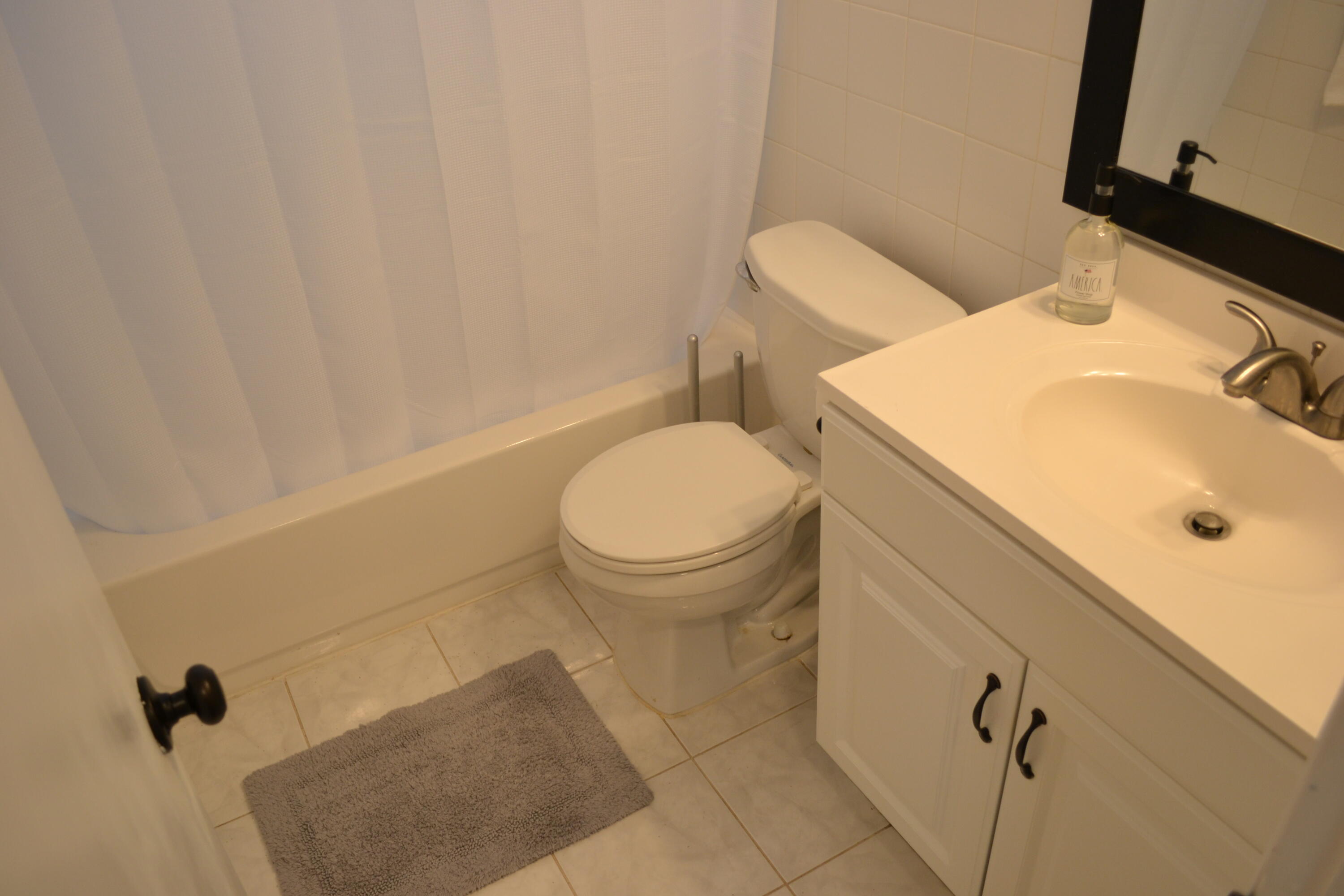 705 North Loxahatchee Drive Jupiter, FL 33458 - Photo 14 of 25 a bathroom with a sink and a toilet