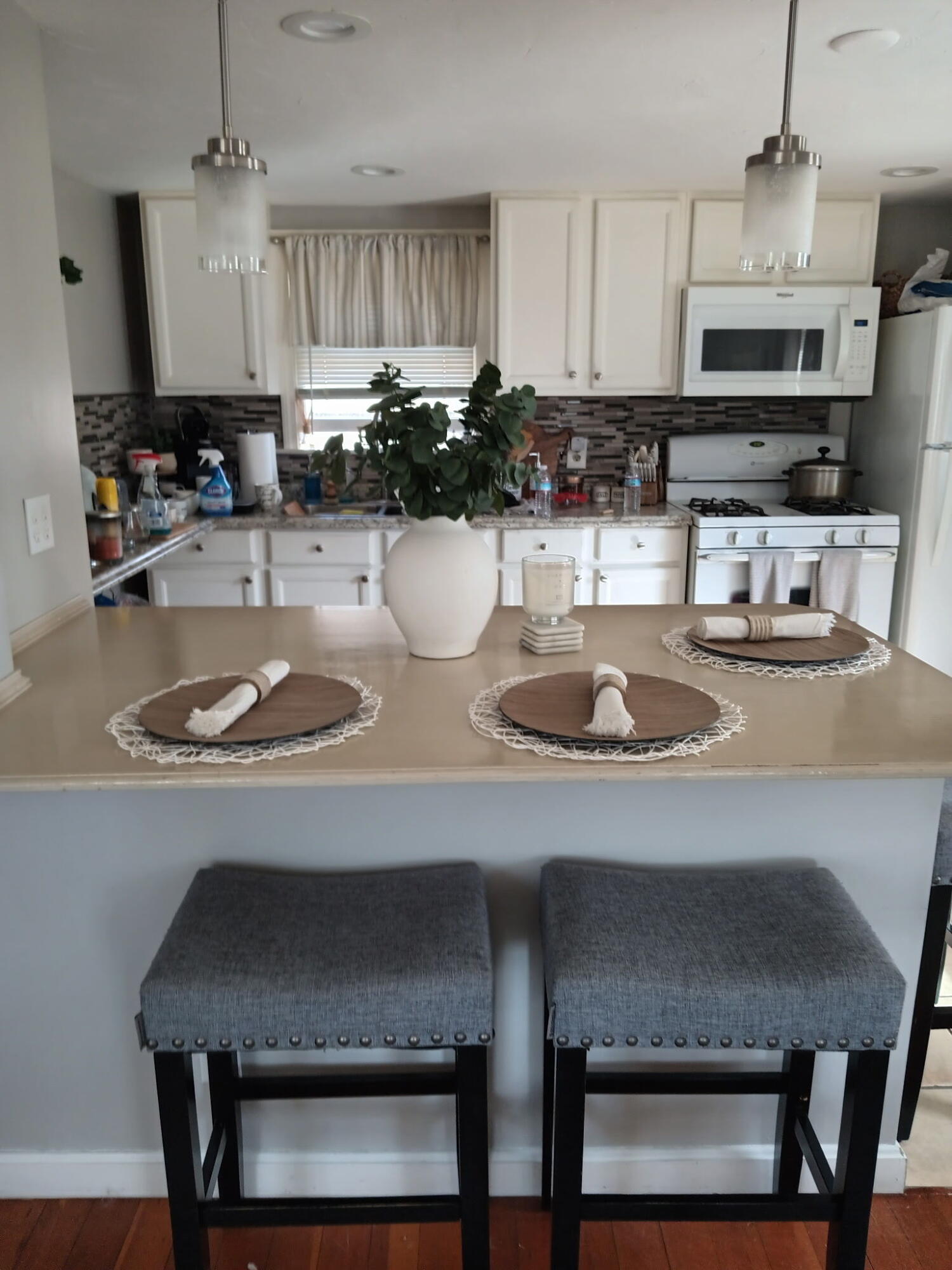a kitchen with a dining table and chairs