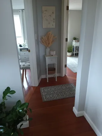 a living room with furniture and a rug