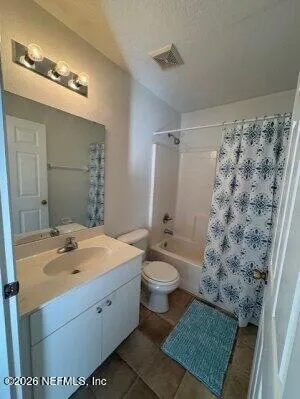a bathroom with a sink a toilet a shower and a mirror