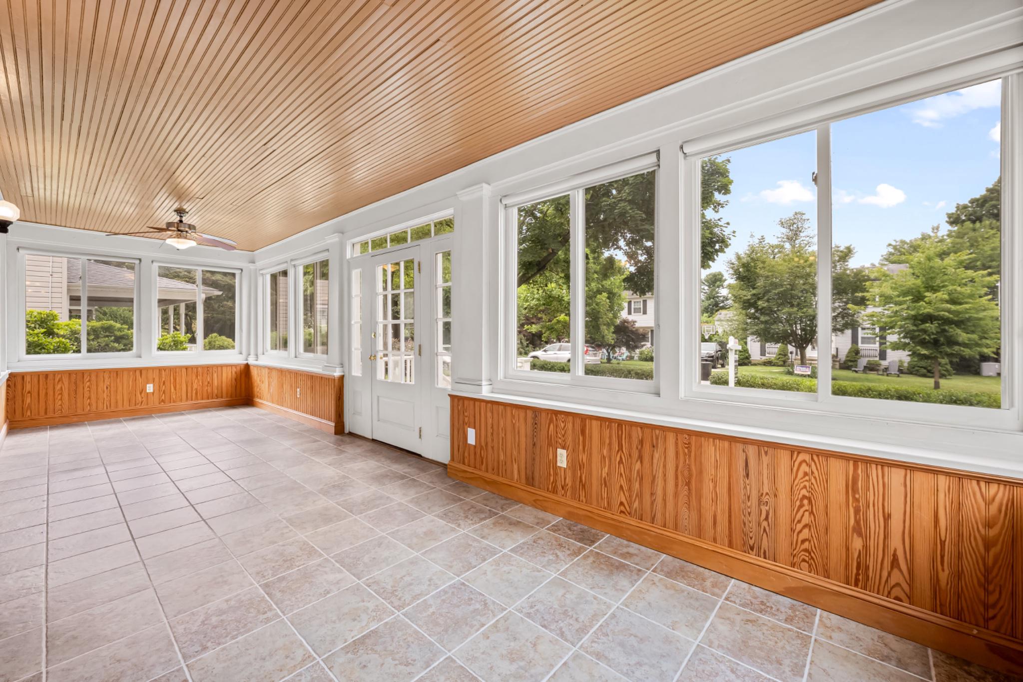 Bright sunroom with lush, scenic views.