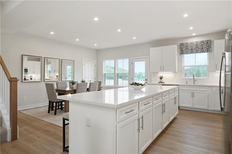 166 Elk Rdg Drive Coraopolis, PA 15108 - Photo 6 of 14 a large white kitchen with lots of counter space wooden floor and appliances