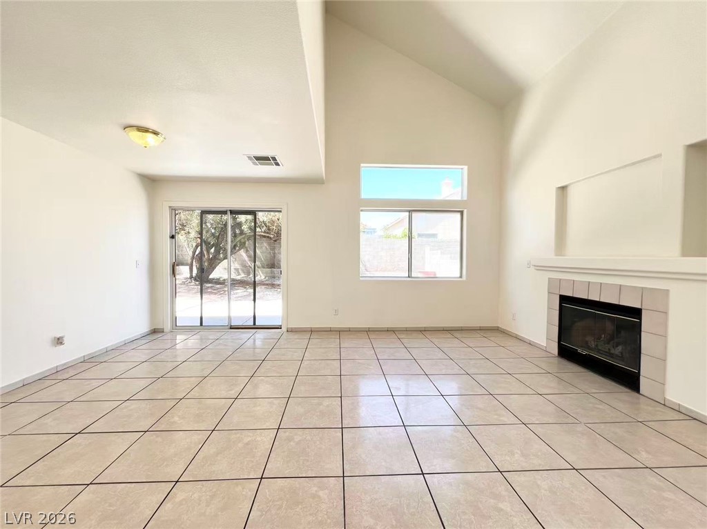 8284 West Rochelle Avenue Las Vegas, NV 89147 - Photo 8 of 29 A spacious living area with soaring ceilings and abundant natural light.