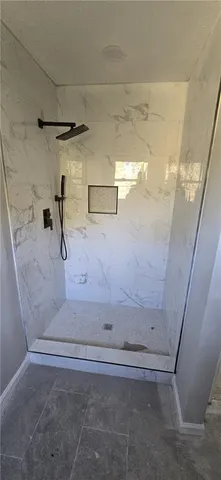 a view of a hallway with stairs