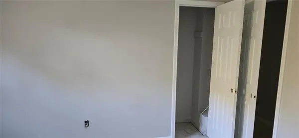 a bathroom with a bathtub and window