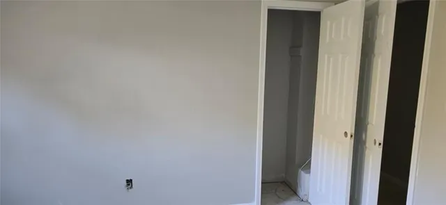 a bathroom with a bathtub and window