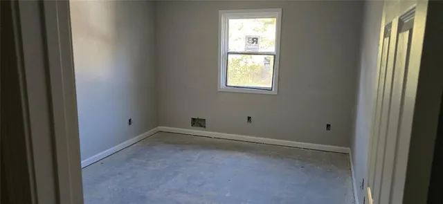 a view of a hallway with windows