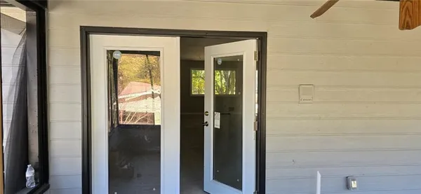 a view of an empty room and window