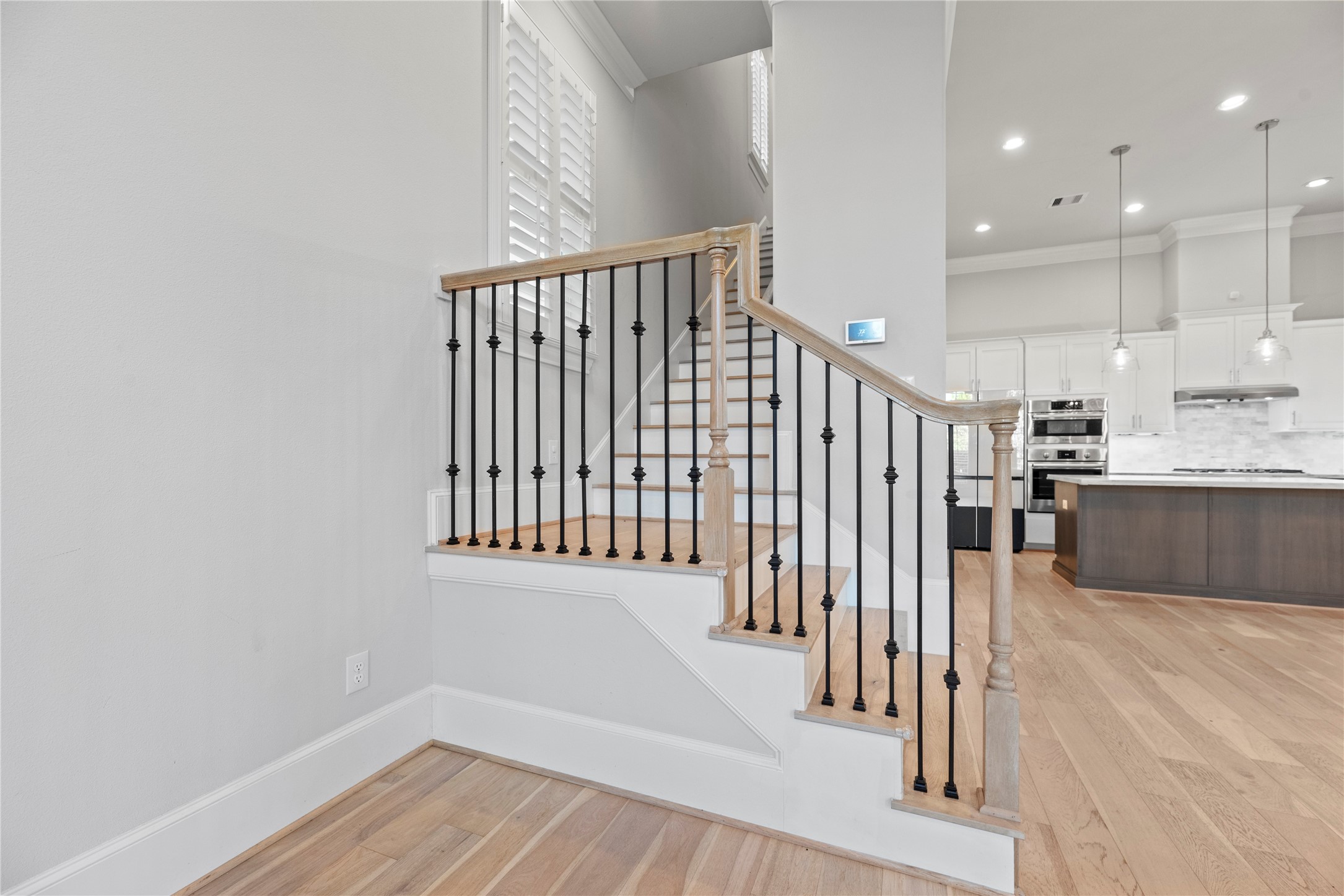 5306 South Capitol Street Houston, TX 77023 - Photo 11 of 28 a view of a kitchen with wooden floor and electronic appliances