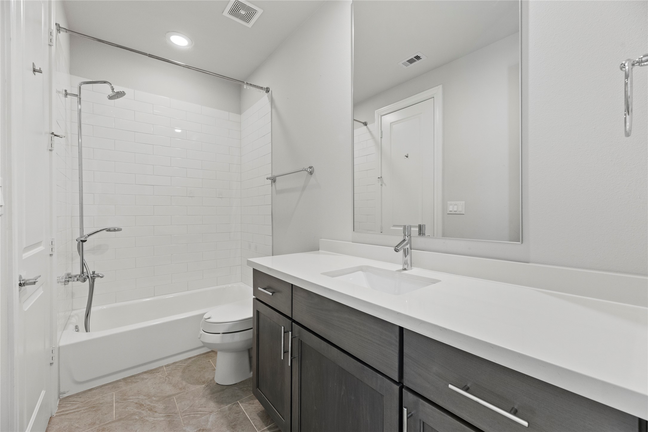 5306 South Capitol Street Houston, TX 77023 - Photo 21 of 28 a bathroom with a sink toilet vanity and shower