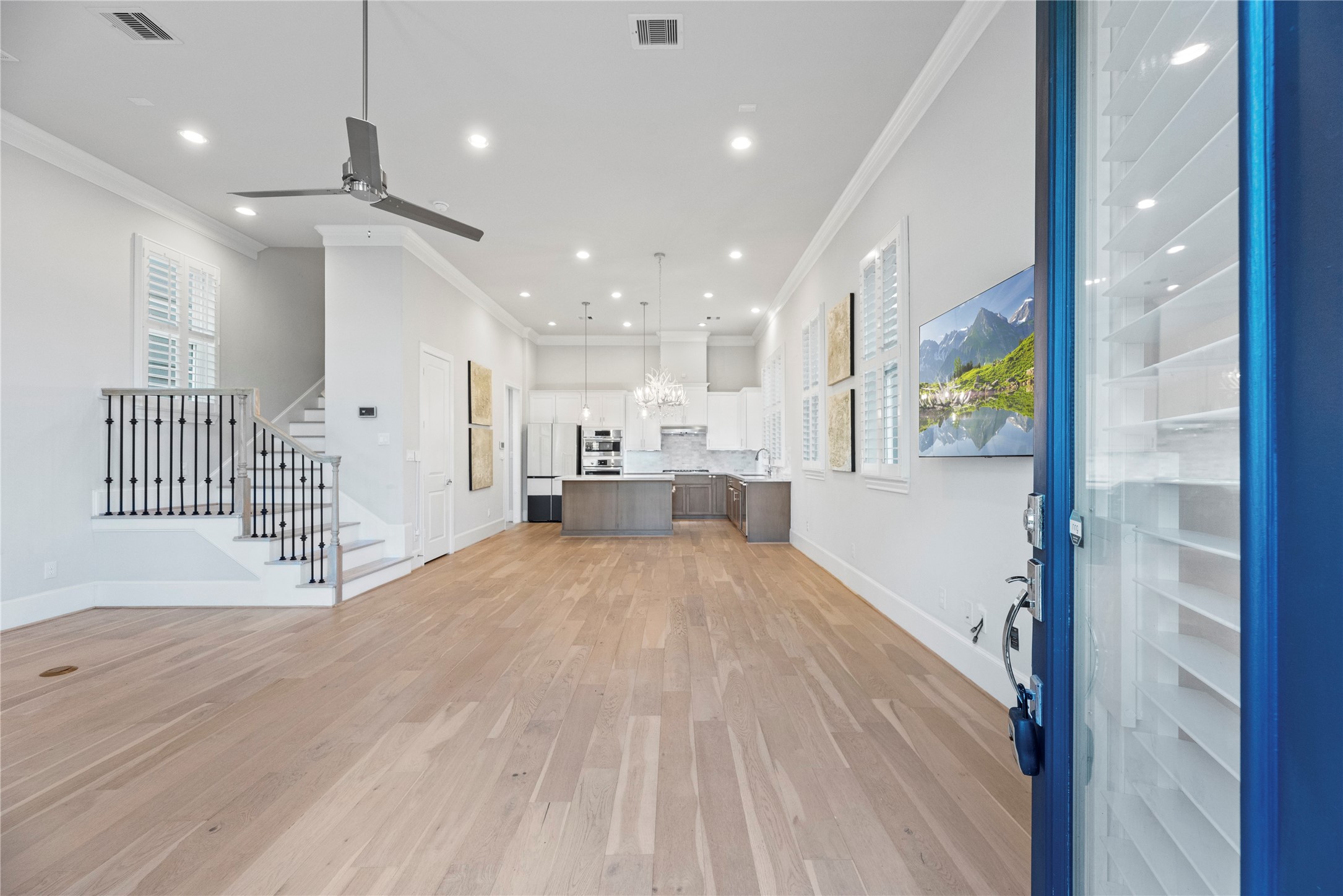 5306 South Capitol Street Houston, TX 77023 - Photo 3 of 28 a view of livingroom with stainless steel appliances wooden floor and windows