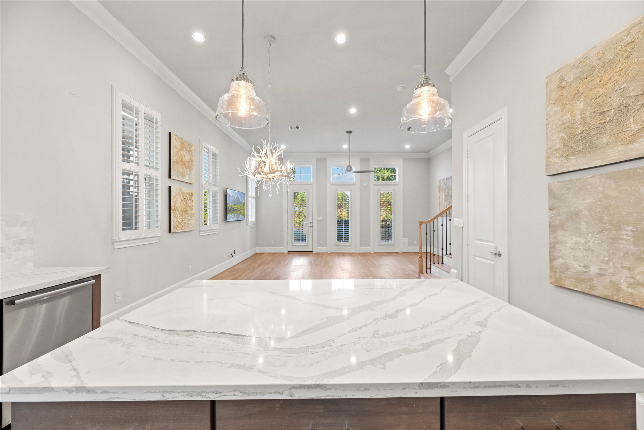 5306 South Capitol Street Houston, TX 77023 - Photo 10 of 28 a large white kitchen with wooden floor
