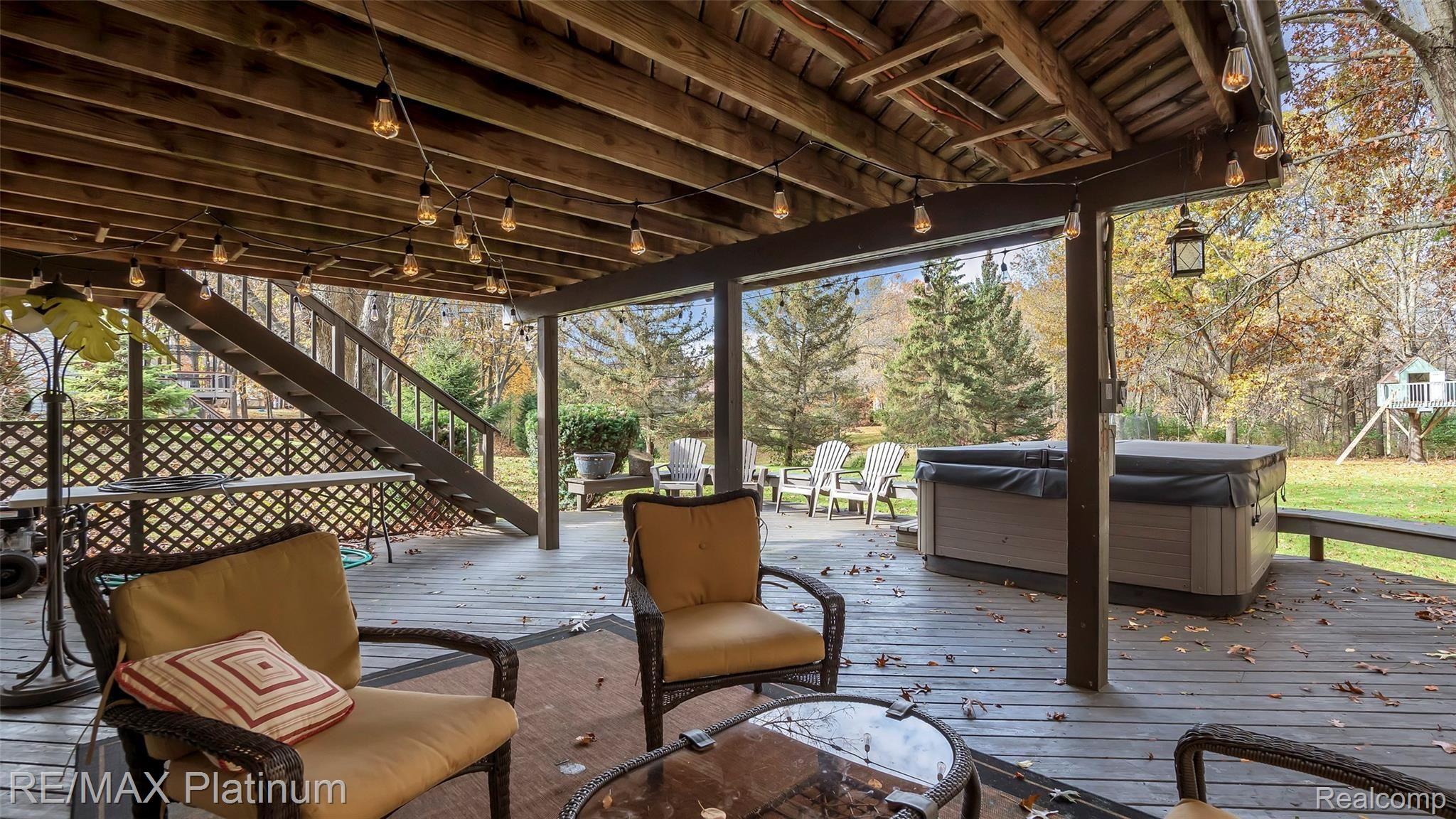 2439 Sunny Ridge Drive Pinckney, MI 48169 - Photo 30 of 42 Huge Lower Level Deck For Entertaining And Room For A Hot Tub