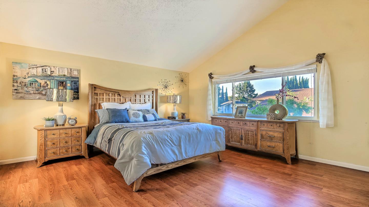 5709 Silver Leaf Road San Jose, CA 95138 - Photo 13 of 21 a bedroom with a bed and a large window