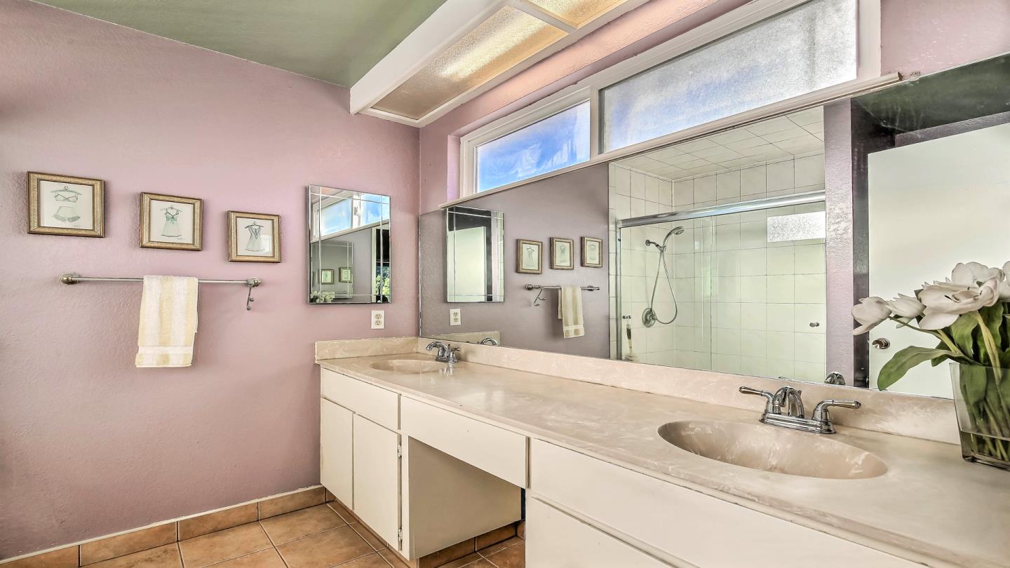 5709 Silver Leaf Road San Jose, CA 95138 - Photo 15 of 21 a bathroom with a sink and a mirror