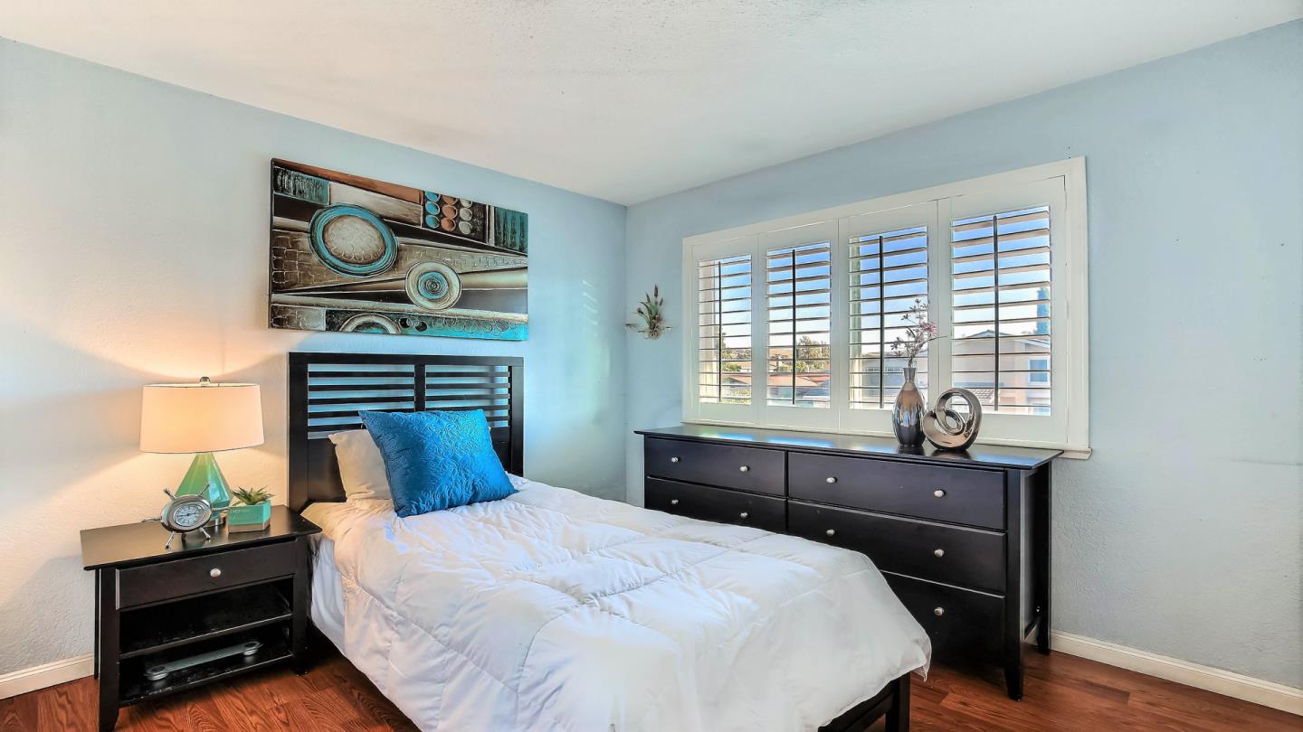 5709 Silver Leaf Road San Jose, CA 95138 - Photo 18 of 21 a bedroom with a bed and a dresser