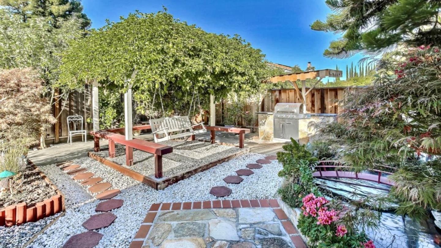 5709 Silver Leaf Road San Jose, CA 95138 - Photo 20 of 21 a view of a patio with couches and table and chairs and potted plants