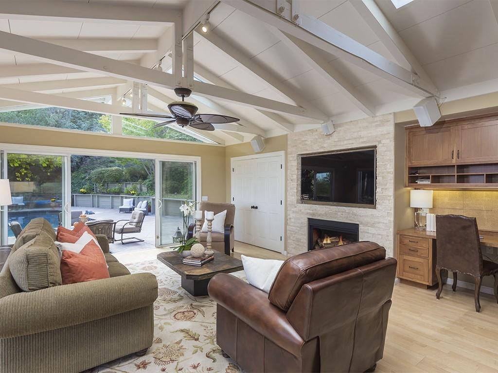518 Patrol Road Woodside, CA 94062 - Photo 13 of 37 a living room with fireplace furniture and a flat screen tv