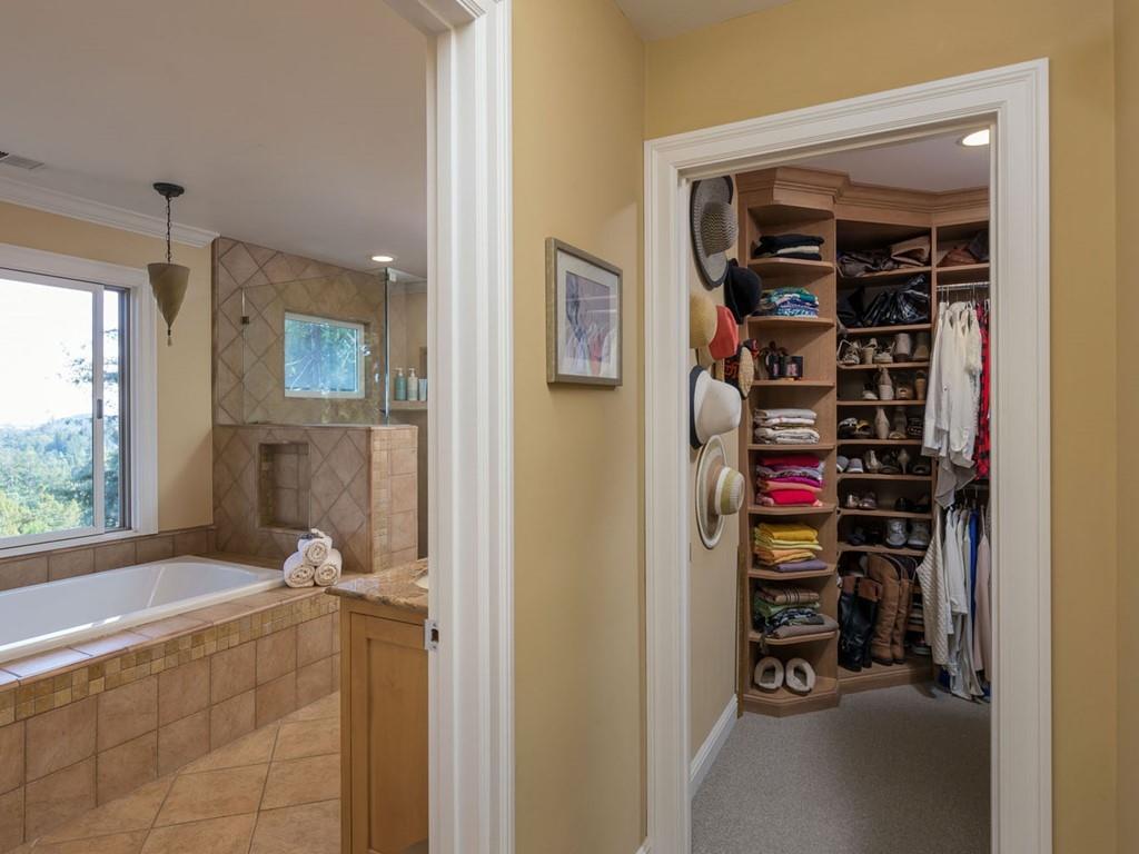 518 Patrol Road Woodside, CA 94062 - Photo 17 of 37 a view of walk in closet with clothes and shoes