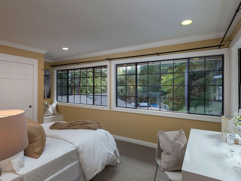518 Patrol Road Woodside, CA 94062 - Photo 20 of 37 a bed sitting in a room next to a large window