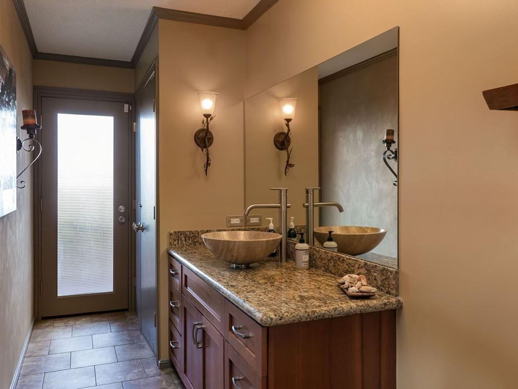 518 Patrol Road Woodside, CA 94062 - Photo 23 of 37 a bathroom with a granite countertop sink and a mirror