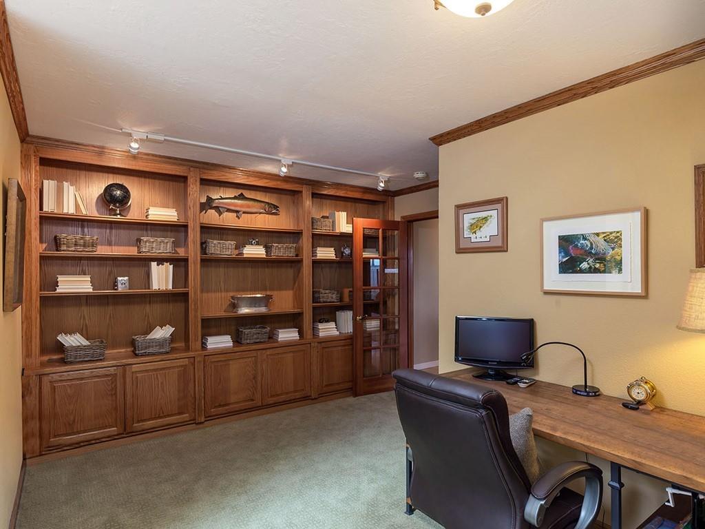 518 Patrol Road Woodside, CA 94062 - Photo 24 of 37 a view of workspace with bookshelf