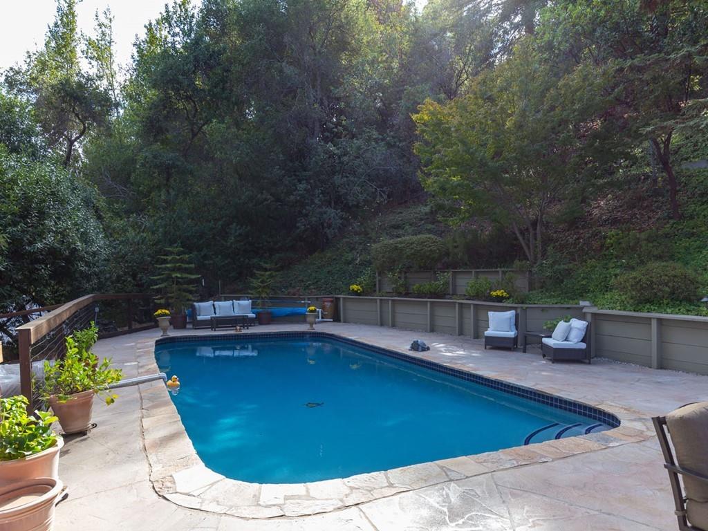 518 Patrol Road Woodside, CA 94062 - Photo 26 of 37 a view of a swimming pool with a patio
