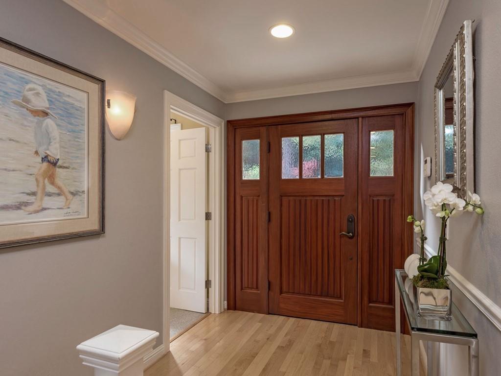 518 Patrol Road Woodside, CA 94062 - Photo 4 of 37 a view of a hallway with wooden floor and windows