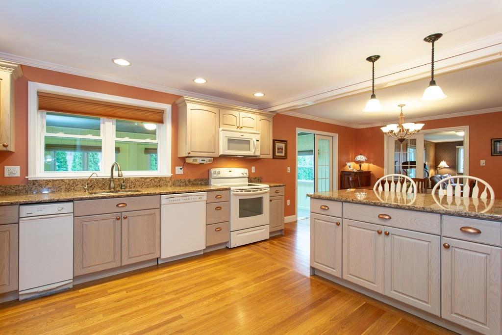 79 Wenonah Road Longmeadow, MA 01106 - Photo 11 of 29 a kitchen with granite countertop a stove and white cabinets