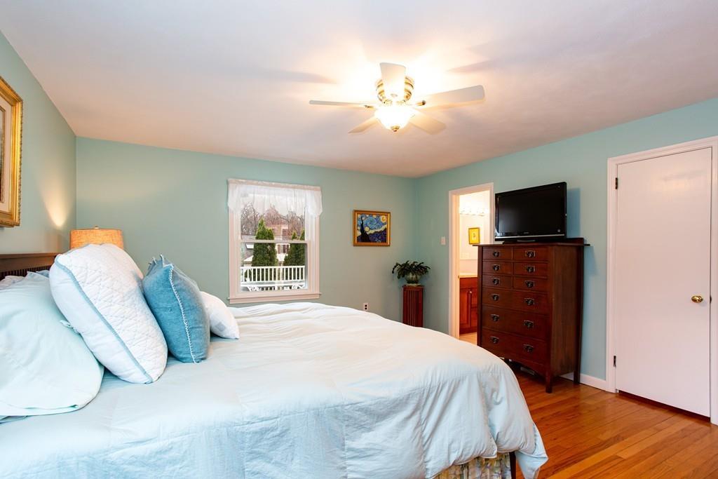 79 Wenonah Road Longmeadow, MA 01106 - Photo 16 of 29 a bedroom with a bed and a flat screen tv