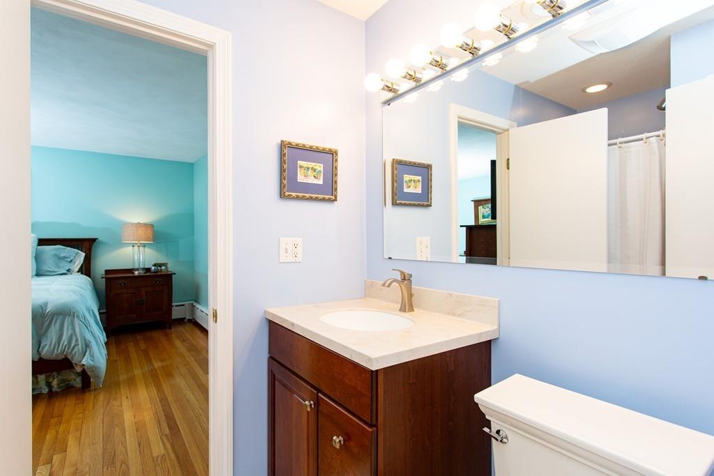 79 Wenonah Road Longmeadow, MA 01106 - Photo 17 of 29 a bathroom with a sink a toilet and a mirror