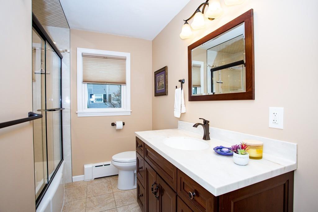 79 Wenonah Road Longmeadow, MA 01106 - Photo 20 of 29 a bathroom with a sink a toilet and a mirror
