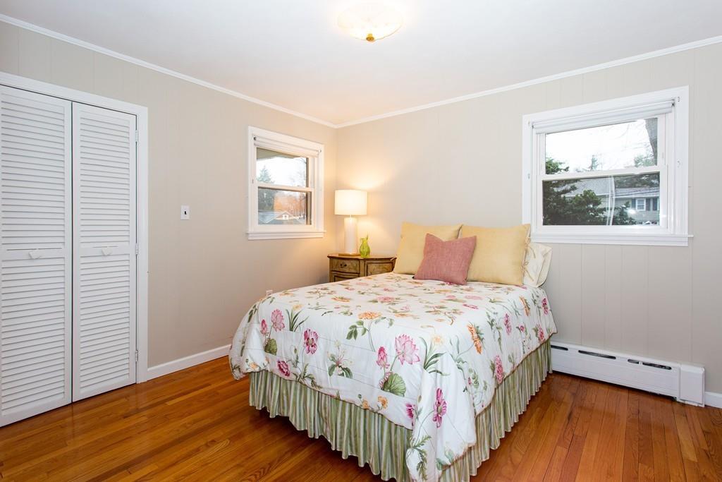 79 Wenonah Road Longmeadow, MA 01106 - Photo 22 of 29 a bedroom with a bed and wooden floor