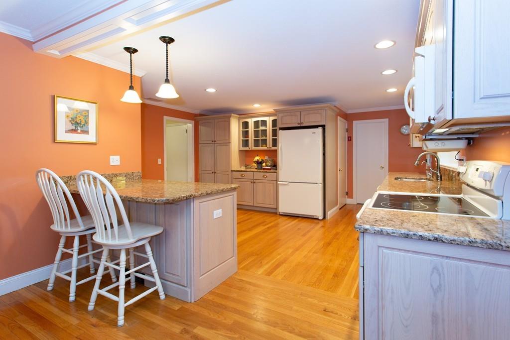 79 Wenonah Road Longmeadow, MA 01106 - Photo 10 of 29 a kitchen with stainless steel appliances granite countertop a sink a stove and a refrigerator