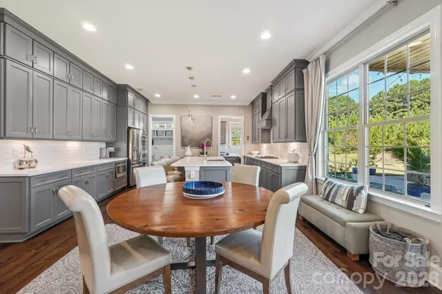 a spacious bathroom with a granite countertop sink and mirror
