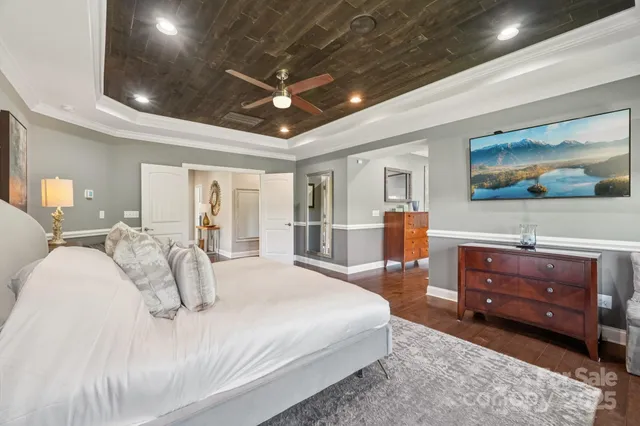 a spacious bedroom with a bed and furniture