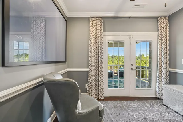 a building outdoor space with patio furniture and potted plants