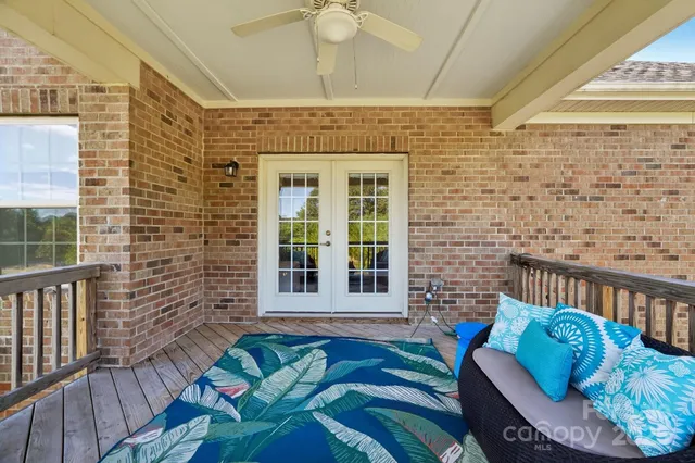 a view of a balcony with furniture