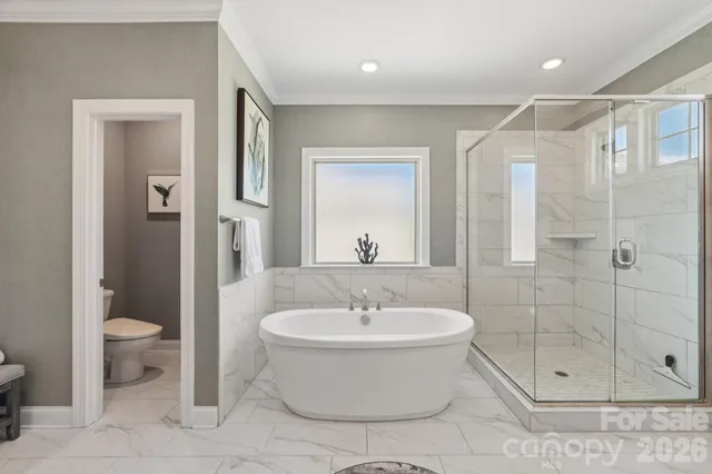 an aerial view of a house with a swimming pool yard and outdoor seating