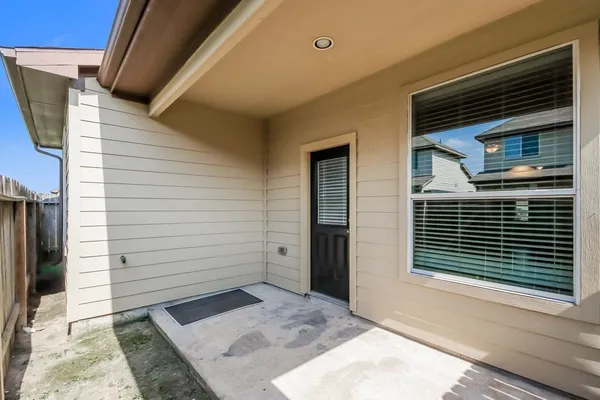 a view of house and front door of wooden house