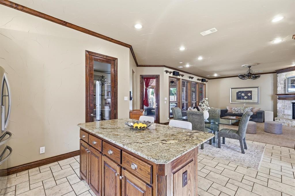 727 Madison Street Coppell, TX 75019 - Photo 12 of 36 a kitchen with sink and view of living room