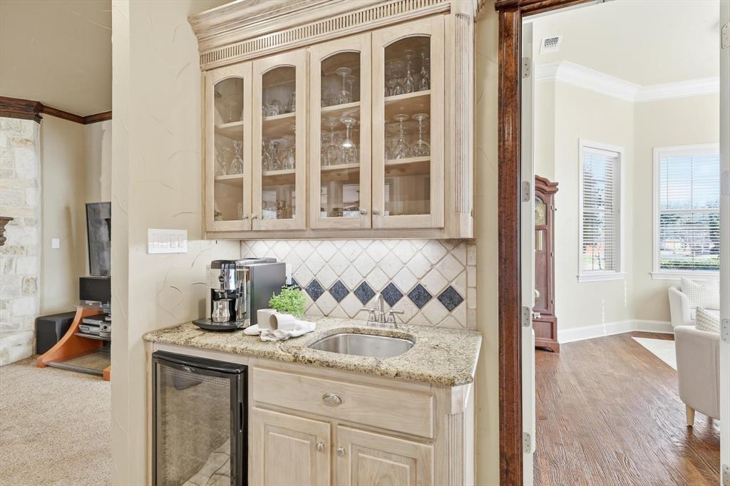 727 Madison Street Coppell, TX 75019 - Photo 13 of 36 a bathroom with a granite countertop sink and a mirror