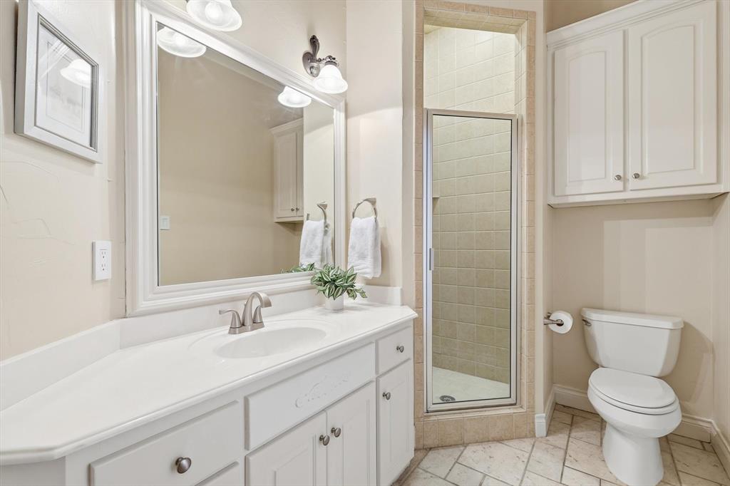 727 Madison Street Coppell, TX 75019 - Photo 16 of 36 a bathroom with a sink toilet and shower