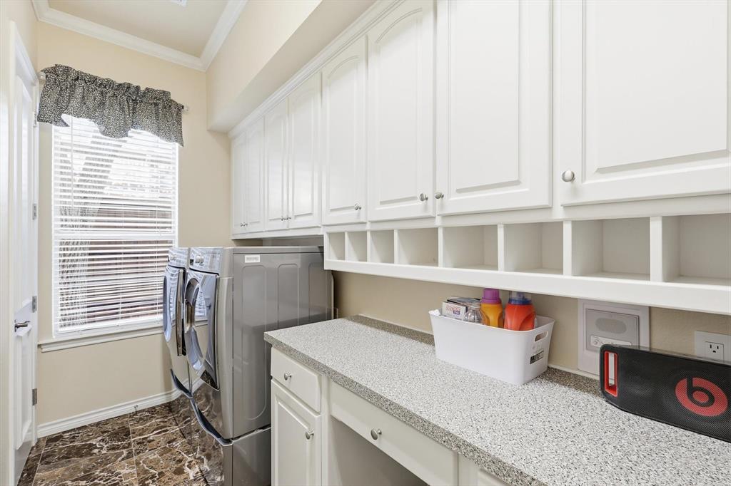 727 Madison Street Coppell, TX 75019 - Photo 17 of 36 a utility room with dryer and washer