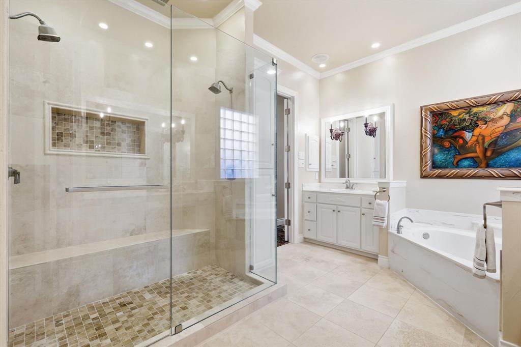 727 Madison Street Coppell, TX 75019 - Photo 20 of 36 a bathroom with a tub sink shower and mirror