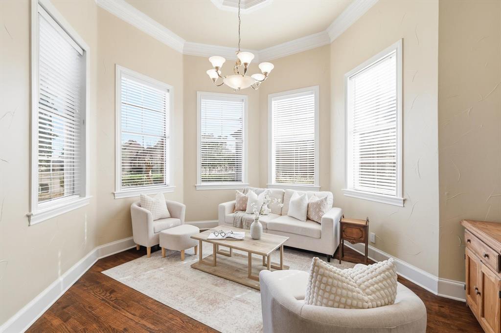 727 Madison Street Coppell, TX 75019 - Photo 2 of 36 a living room with furniture and a large window